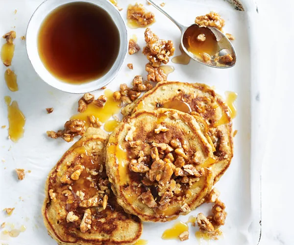 sticky date pancakes topped with walnuts