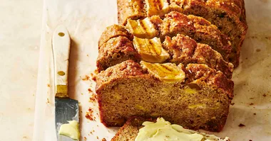 Banana bread sliced on a board