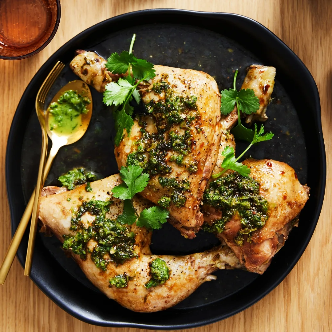 hainanese chicken rice on a black plate
