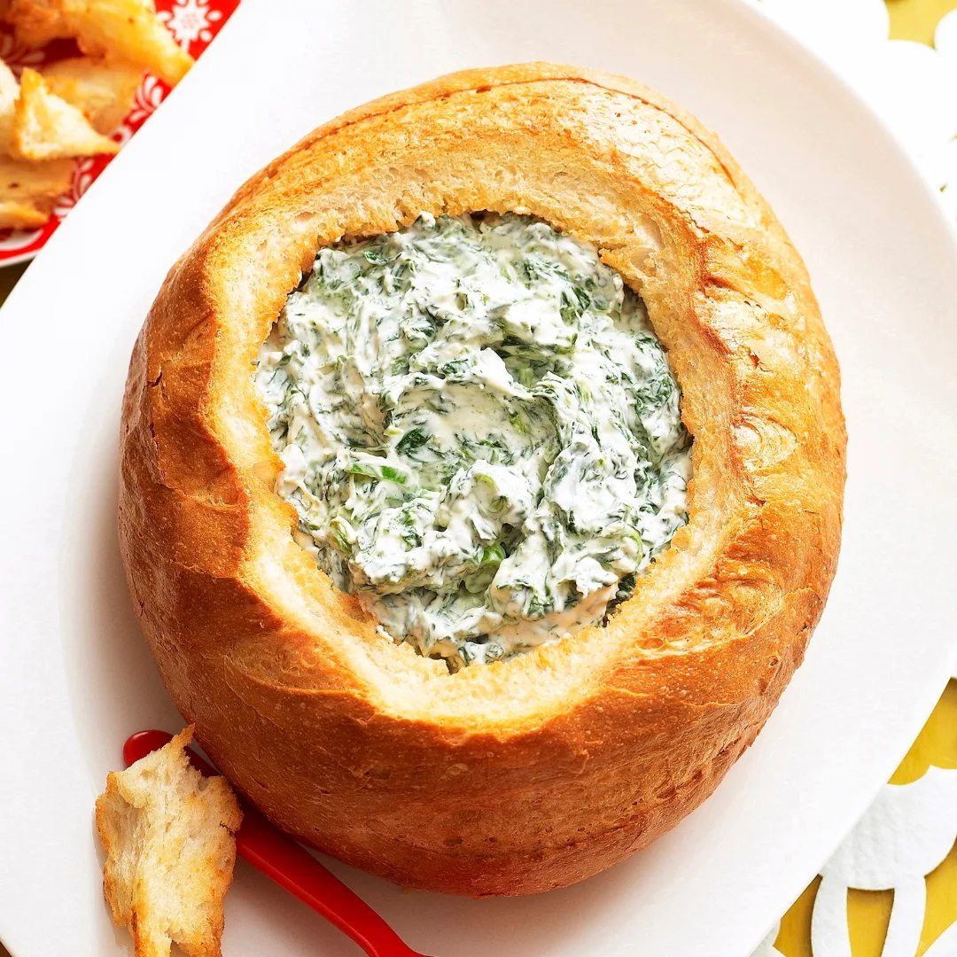 spinach cob loaf dip on a white platter