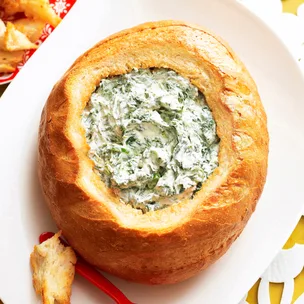 spinach cob loaf dip on a white platter