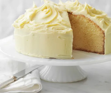 White chocolate mud cake on white cake stand