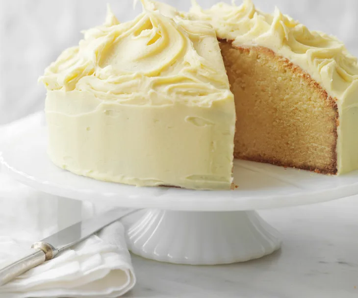 White chocolate mud cake on white cake stand