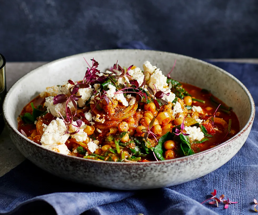 Large bowl of chickpea, spinach and paneer rogan josh