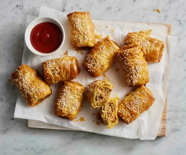 Sausage rolls in a basket for footy finals parties