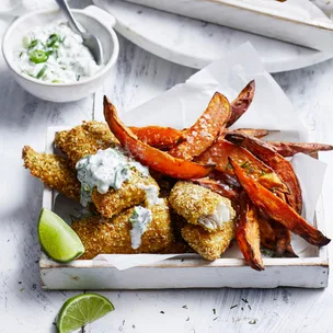 air fryer fish and chips with tartare and lime wedges