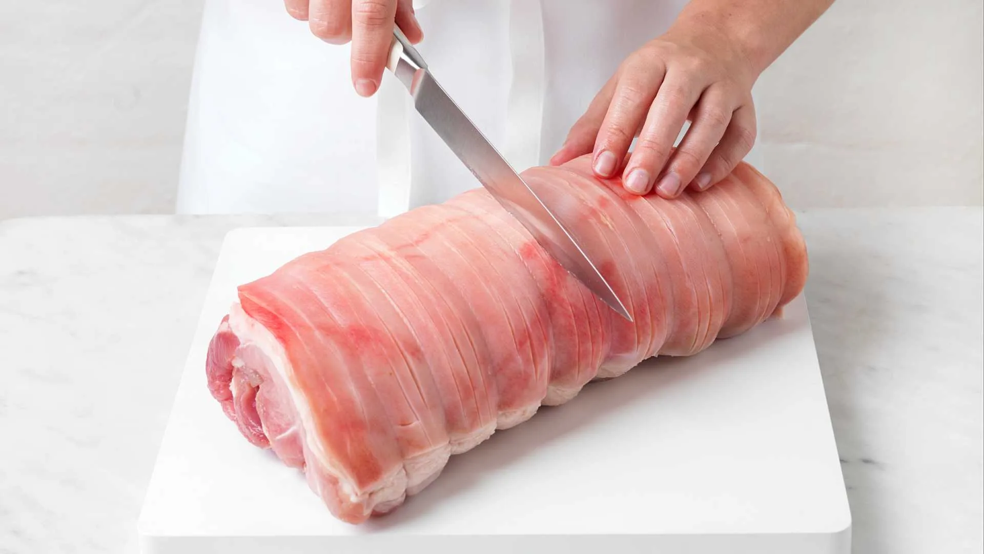 Scoring the roast pork loin