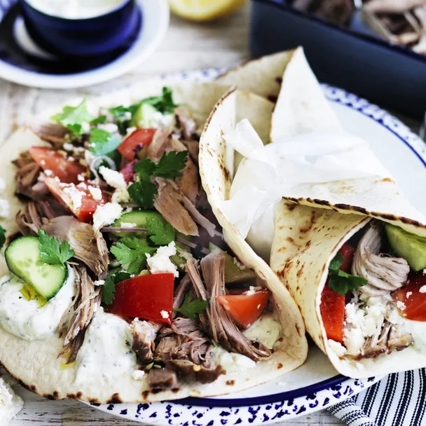 slow cooker pork shoulder in gyros wraps with salad