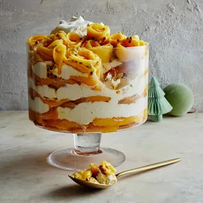 Mango tiramisu layered in a glass bowl