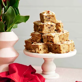 Sliced Christmas blondies on a cake stand