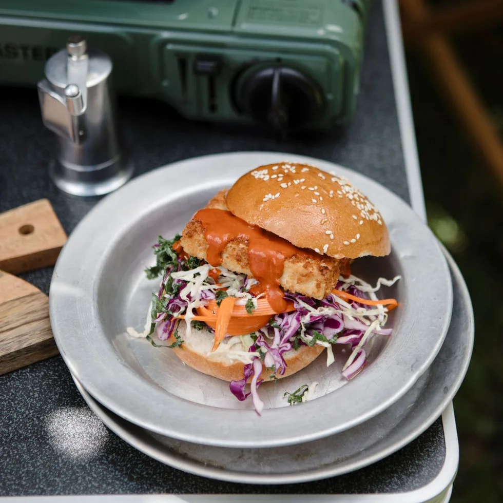 Tofu burger on an aluminium plate