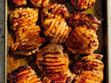 Close of up barbecued chicken thigh fillets