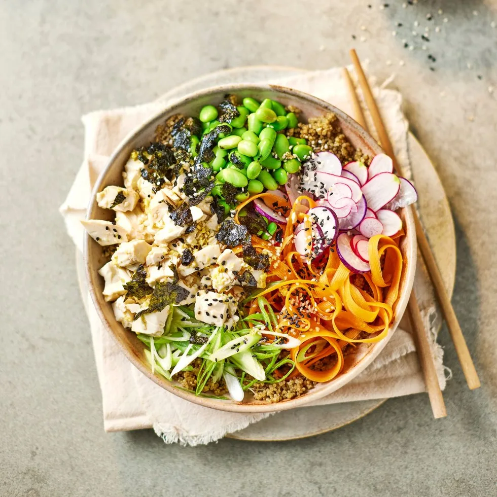 Ponzu tofu poke bowl on a table with chopsticks