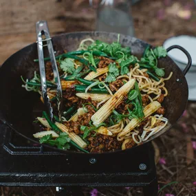 Ramen noodles & pork stir-fry cooked over a campfire