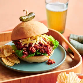 Bolognese Sloppy Joes on a plate with potato chips