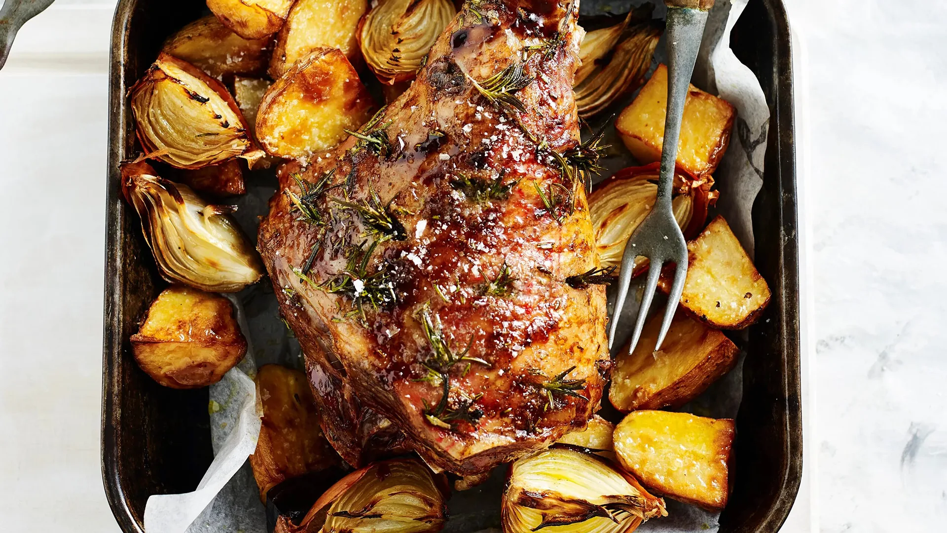 Roast leg of lamb with gravy and potatoes