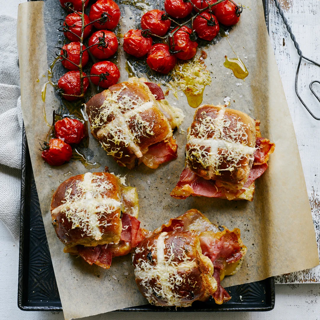 Hot cross bun prosciutto & cheese toasties with roasted vine-ripened tomatoes
