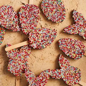 Chocolate freckles in the shape of Easter eggs and chocolate bunnies.