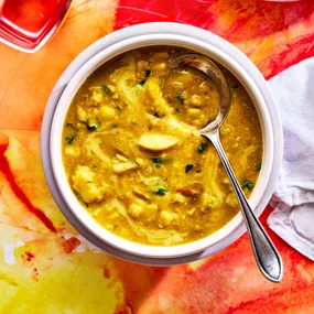 bowl of corn chowder with coconut and lentils