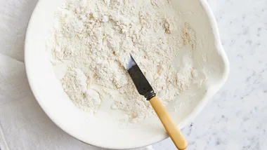 flour and sugar in a bowl to make scones