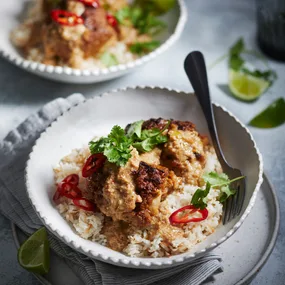 slow cooker satay chicken in a bowl