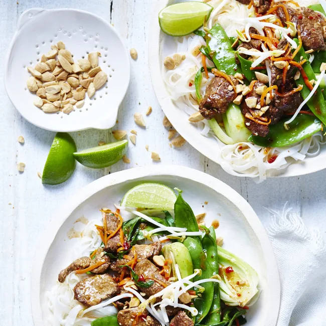 five spice pork with almonds on a white plate
