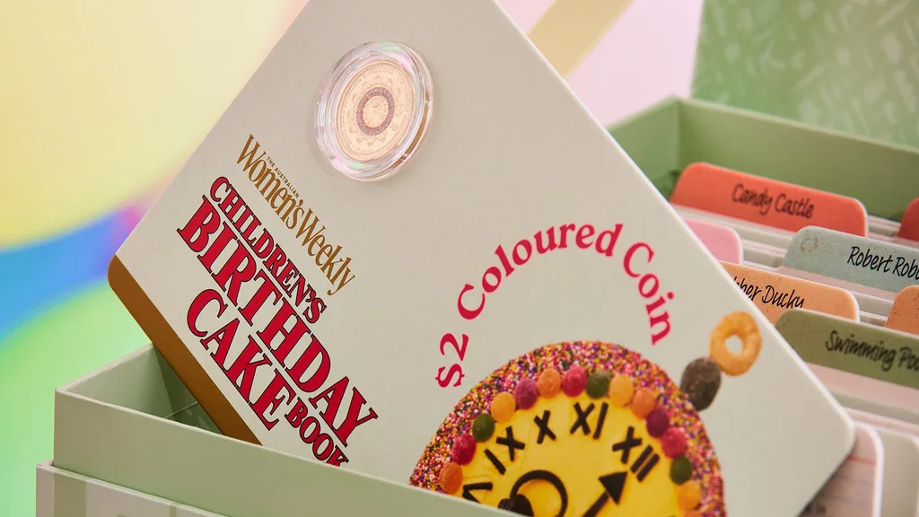 The coloured $2 coin in the Women's Weekly Children's Birthday Cake Book Coin collection