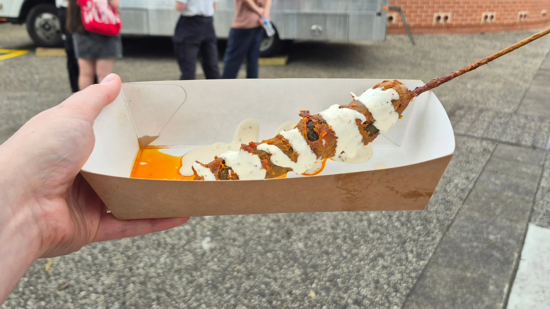 Nashville Hot Pickle on a Stick in a container by a food truck in the Royal Easter Show 2026 showground
