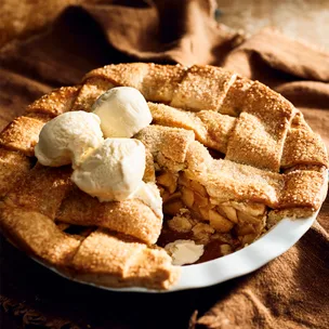 Deep dish gluten-free apple pie with almond crust, served with vanilla ice-cream