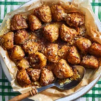 A plate full of roast potatoes
