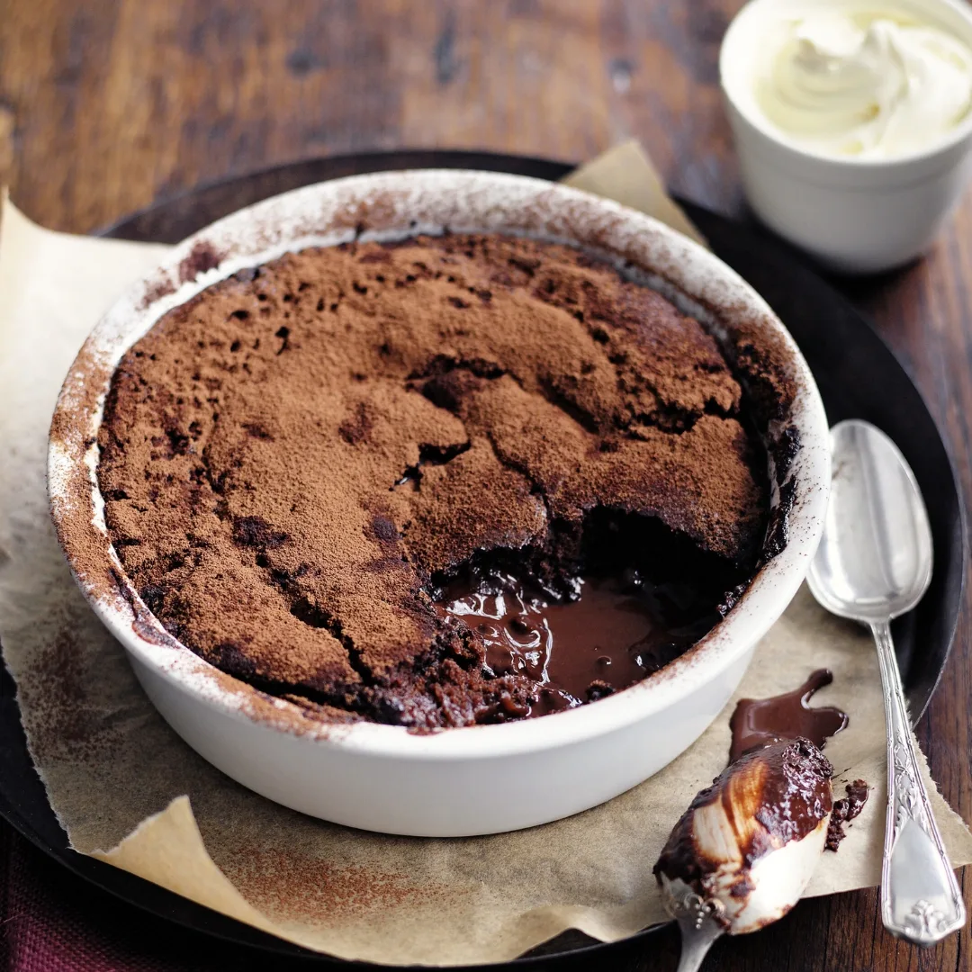 Easy chocolate cocoa self saucing pudding in a white dish