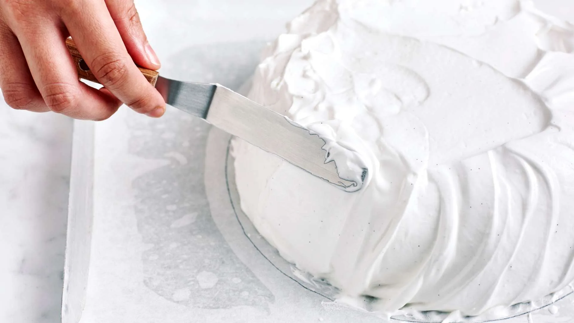 Using palette knife or spatula, shape sides of meringue and level the top