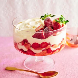 A strawberry tiramisu layered in a large glass bowl