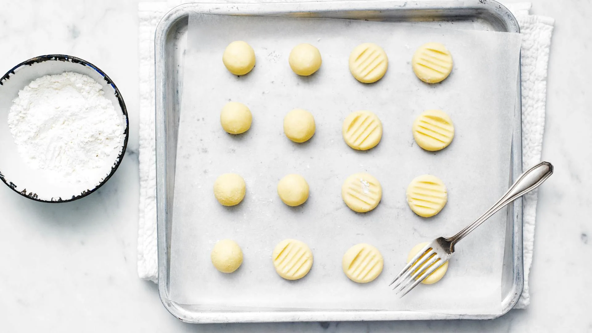 Shaping biscuits on a tray