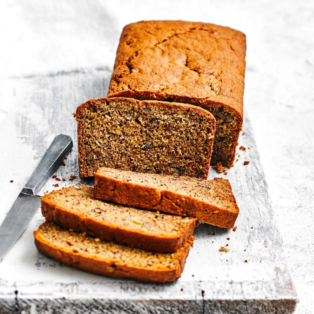 Our best banana bread recipe, sliced on a chopping board