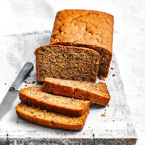Our best banana bread recipe, sliced on a chopping board