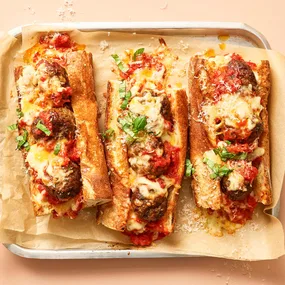 Meatball subs on a baking tray