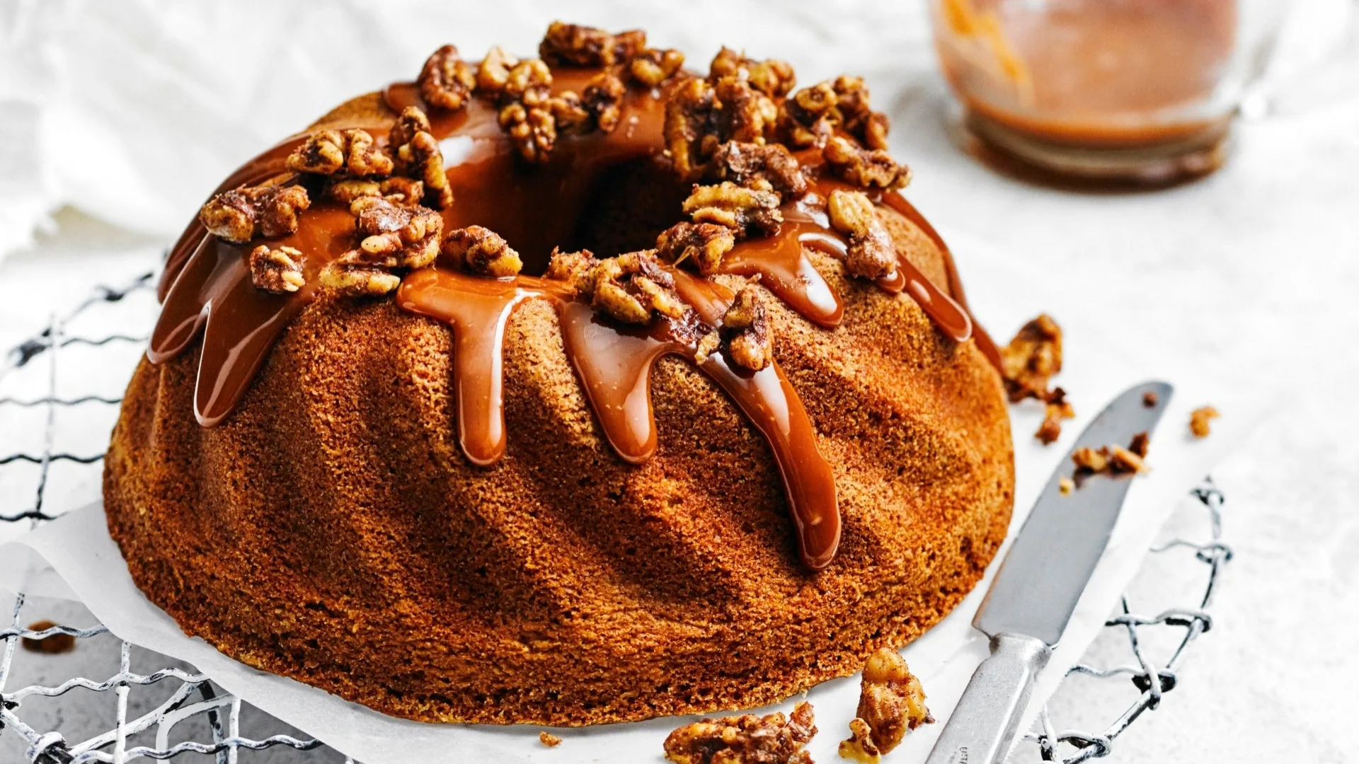 coffee and walnut cake with icing and walnuts on top
