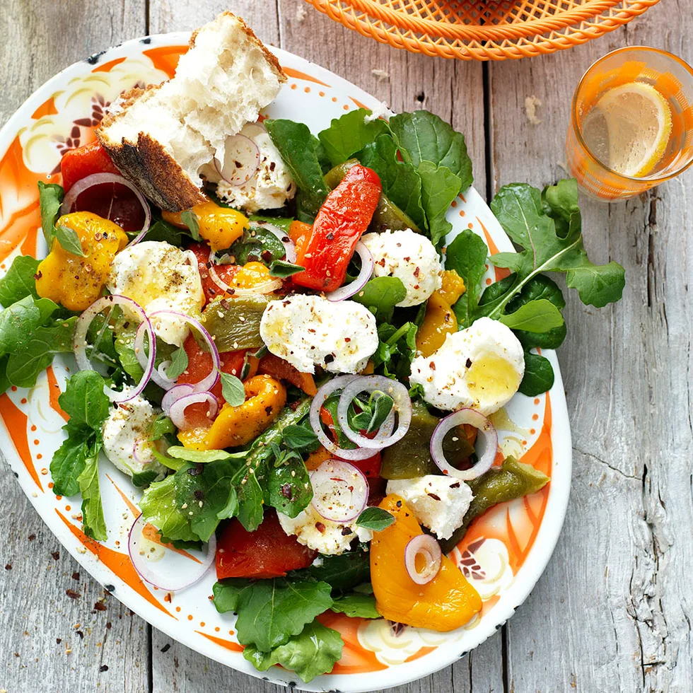 roasted capsicum salad with labne on a serving plate