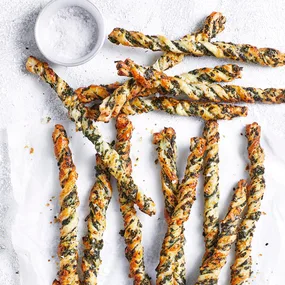 spinach & fetta air fryer puff pastry twists on a serving platter