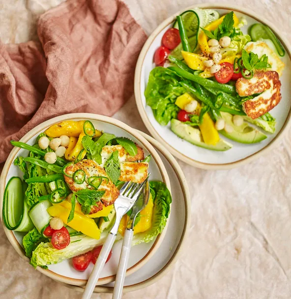 haloumi and mango salad in two bowls