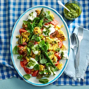 Grilled corn salad with asparagus, ripe tomatoes and creamy buffalo mozzarella