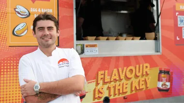 Declan Cleary standing in front of a Lee Kum Kee soy sauce food truck