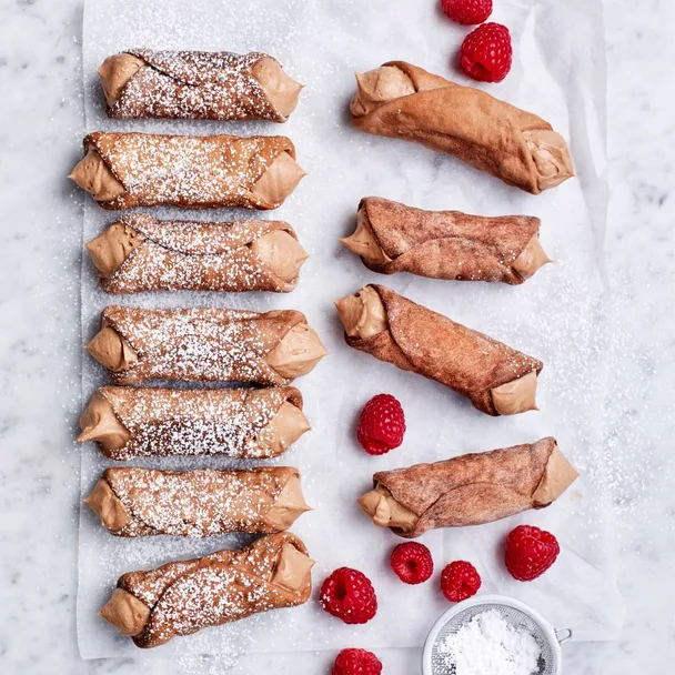 Air fryer Italian chocolate cannoli dessert served with fresh raspberries