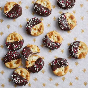 Salted caramel biscuits made from Jatz and dipped in chocolate with sprinkles