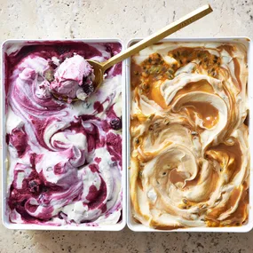 Two flavours of condensed milk ice cream in rectangular tubs