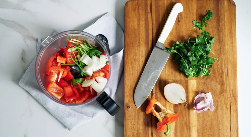 Chopping the ingredients for Julie Goodwin’s Spanish chicken tray bake