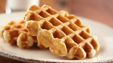 Plain Belgian waffles on a plate with a blurred background