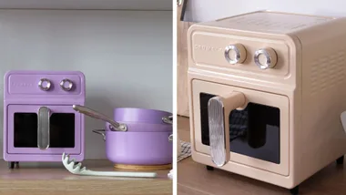 Split image showing a purple Crumble air fryer with matching pots and a cream-coloured Crumble air fryer on a kitchen counter.