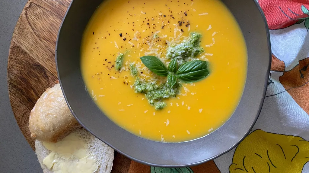 Creamy pumpkin and potato soup with pesto